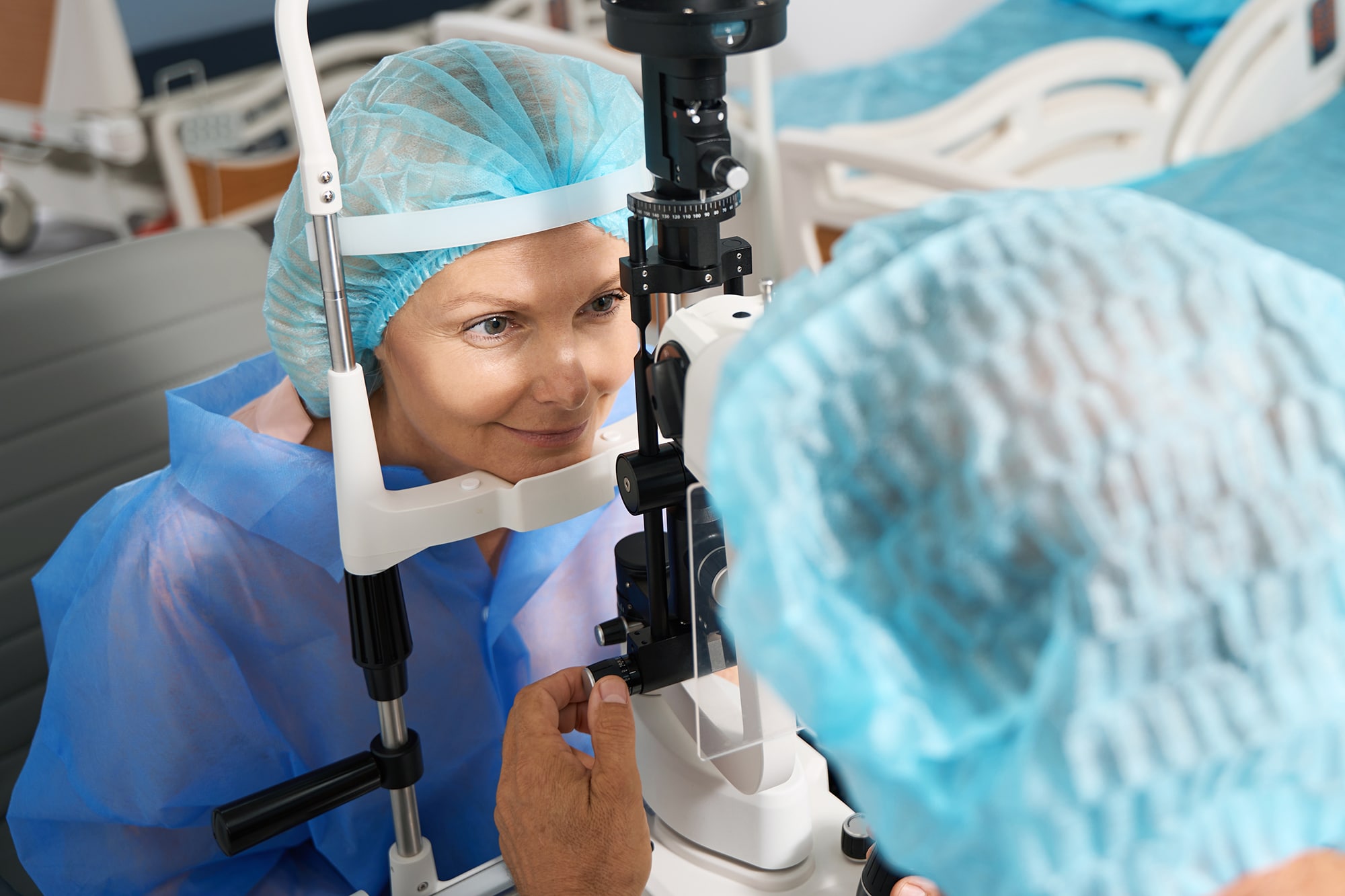 Ophthalmologist examining the eyeball of patient to determine whether LASIK can fix Astigmatism