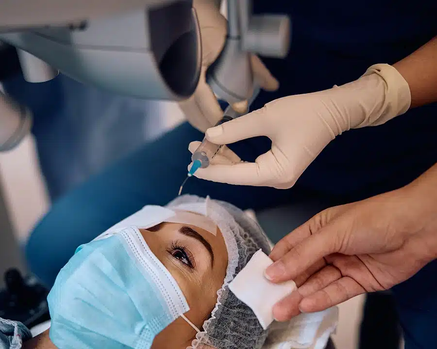 Patient being prepared for SMILE eye surgery with anesthesia eye drops